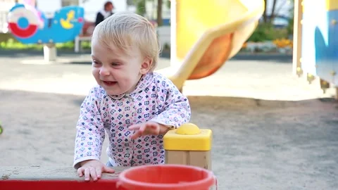 A little boy is playing in the sandbox Stock Footage 135250806