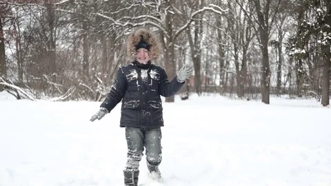Little boy playing in the snow Stock Footage 70314820