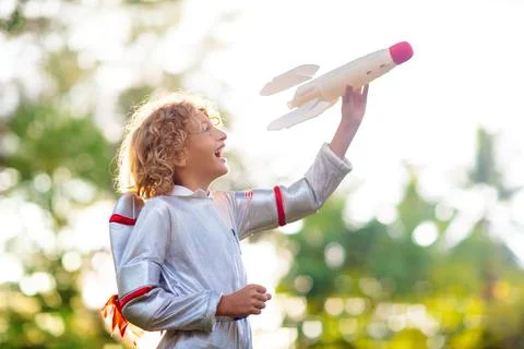 Little boy playing with spaceship. Astronaut kid. Stock Photos