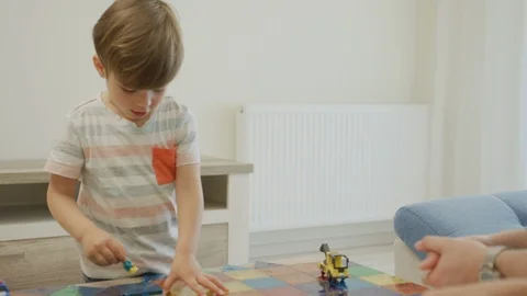 Little boy playing on a table Stock Footage 99999744