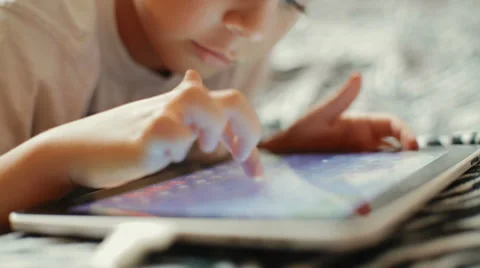 Little boy playing on the tablet computer games Stock-Footage 30655716
