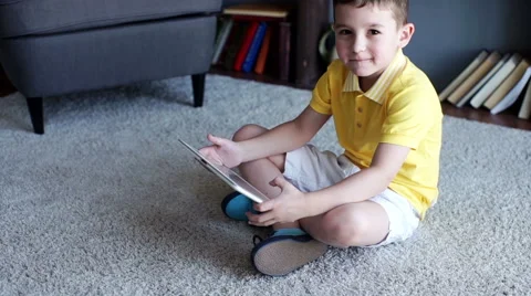 Little boy playing on the tablet computer games Stock Footage 64111287