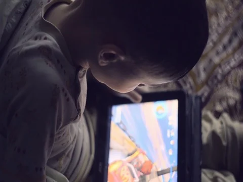 Little boy playing on the tablet computer games Stock Footage 73695496