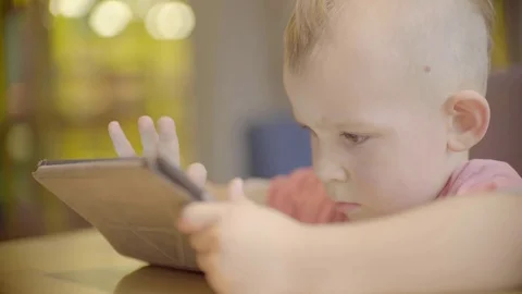 Little boy playing on the tablet Stock Footage 72672824