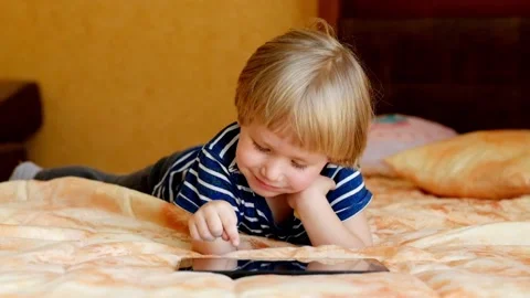 Little boy Playing with Tablet Stock Footage 87948500