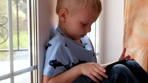 Little boy Playing with Tablet Stock Footage 89465829