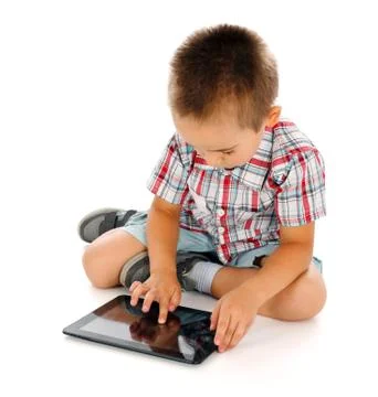 Little boy playing on tablet pc Foto stock