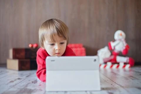 Little boy, playing on tablet Stock Photos