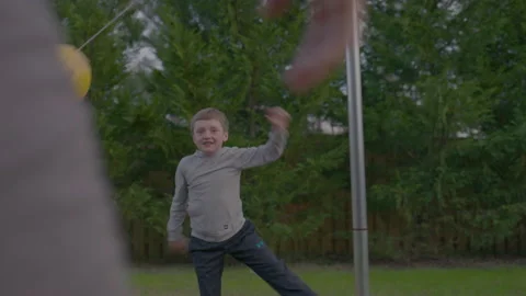 Little Boy Playing Tetherball With Dad Stock Footage 208781917