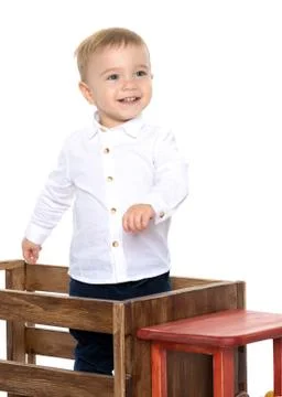A little boy is playing with a toy car. Stock Photos