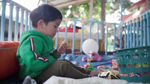 Little boy playing toy Stock Footage 151457518