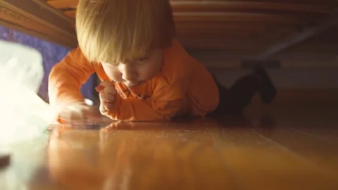 Little boy playing under the bed Stock Footage 119223847