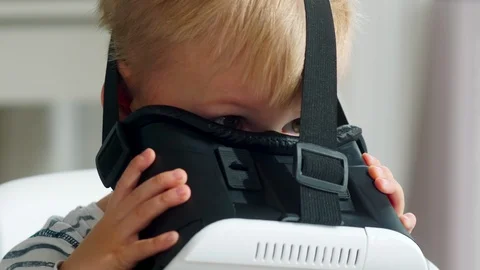 Little Boy Playing in VR Goggles with Excitement Vidéo 101042024