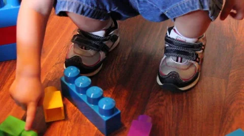 Little boy plays with blocks Stock Footage 44445677