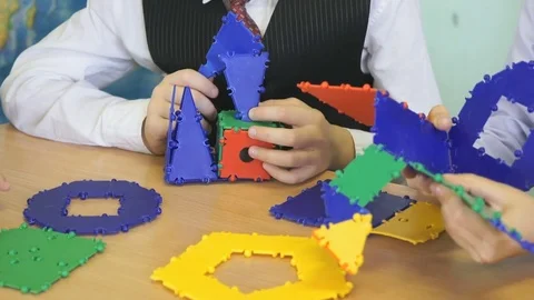 Little boy plays developing toy designer indoors Stock-Footage 80742237