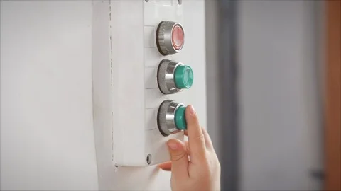 Little boy plays presses the elevator call buttons. Close Up Preschooler's hand Stock Footage 127379999