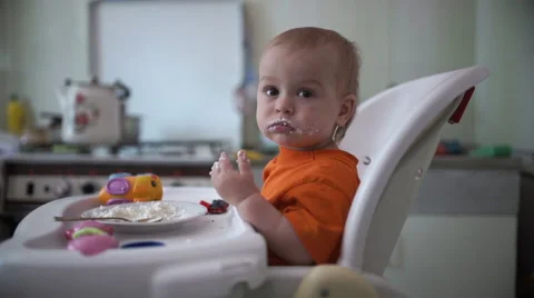 Little boy practices eating in the kitchen 1  - Without color correction Stock Footage 55101596