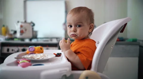 Little boy practices eating in the kitchen 1  - Color corrected Stock-Footage 55101820