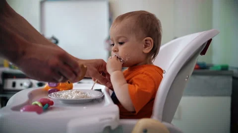 Little boy practices eating in the kitchen 3  - Color corrected Stock Footage 55103017