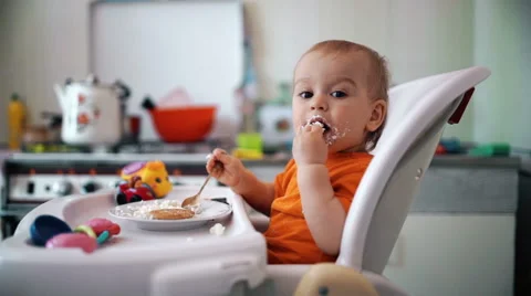 Little boy practices eating in the kitchen 6  - Color corrected Stock-Footage 55105552