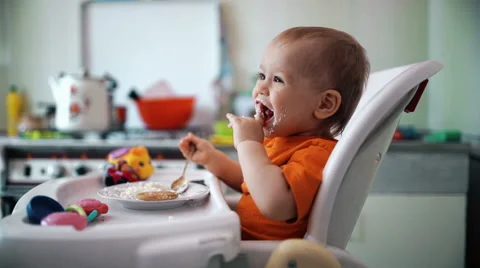 Little boy practices eating in the kitchen 8  - Color corrected Stock-Footage 55105976