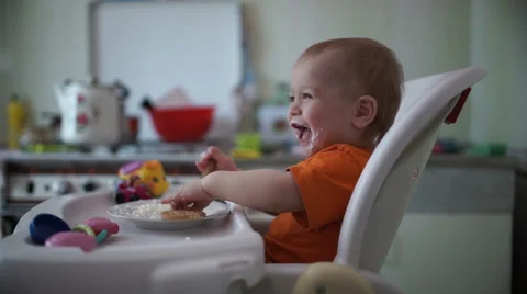 Little boy practices eating in the kitchen 11  - Without color correction Stock-Footage 55105982