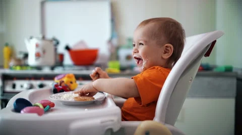 Little boy practices eating in the kitchen 9  - Color corrected Stock-Footage 55105985