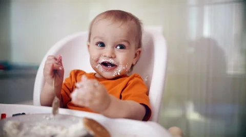 Little boy practices eating in the kitchen 12  - Color corrected Stock-Footage 55107235
