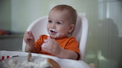 Little boy practices eating in the kitchen 14  - Without color correction Stock-Footage 55107555