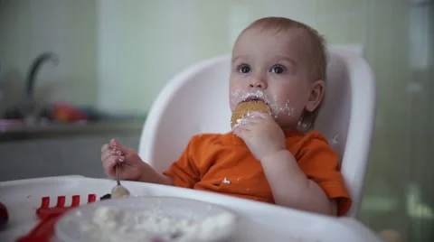 Little boy practices eating in the kitchen 15  - Without color correction Stock-Footage 55107724