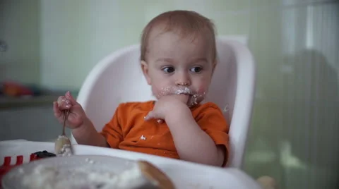 Little boy practices eating in the kitchen 13  - Without color correction Stock-Footage 55108018
