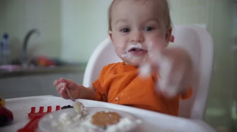 Little boy practices eating in the kitchen 16  - Without color correction Stock-Footage 55108527
