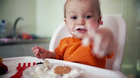 Little boy practices eating in the kitchen 15  - Color corrected Stock-Footage 55108627