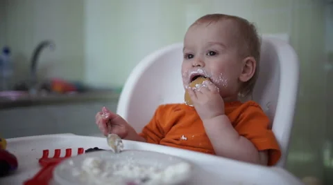 Little boy practices eating in the kitchen 22  - Without color correction Stock-Footage 55108655