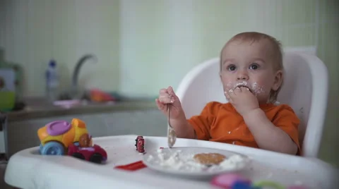 Little boy practices eating in the kitchen 17  - Without color correction Stock-Footage 55108916
