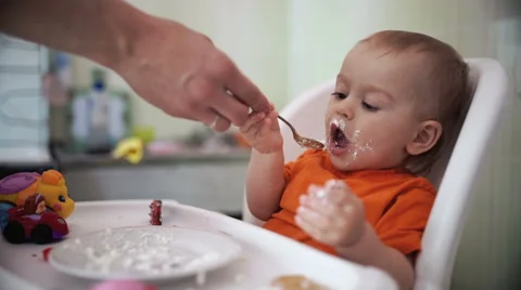 Little boy practices eating in the kitchen 19  - Color corrected Stock Footage 55109282