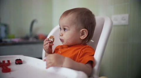 Little boy practices eating in the kitchen 23  - Color corrected Stock Footage 55111293