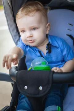 Little boy in pram Stock Photos