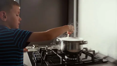 A little boy prepares a magic potion Stock Footage 143308900