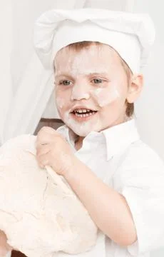 Little boy preparing dough Stock Photos