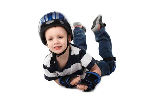Little boy in protective gear fell off his bicycle or scooter or skateboar... Stock Photos