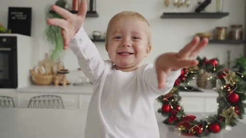 Little boy pulls his arms, hands into the camera, a child tries to hug through Stock Footage 220267451