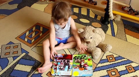 Little boy reading a book 動画素材 62473811