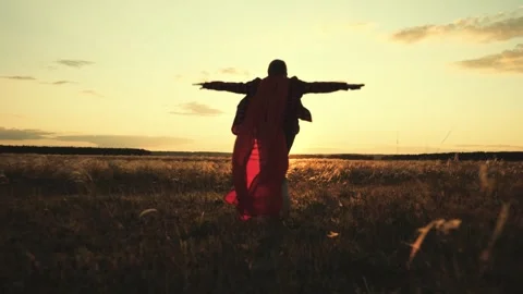 Little boy red cape runs sunset, silhouette superhero child running victory Stock Footage 244209843