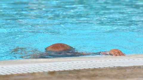 Little boy in red trunks gets out of the hotels pool Stock-Footage 35234163