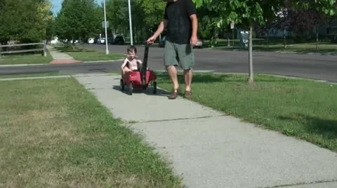 Little Boy in Red Wagon 動画素材 12593293