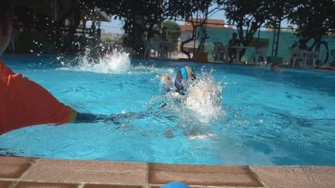 Little boy relaxing training lesson in swimming pool summer time Stockbeeldmateriaal 74617641