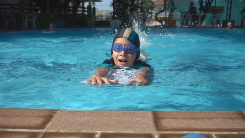 Little boy relaxing training lesson in swimming pool summer time Stockbeeldmateriaal 74618092
