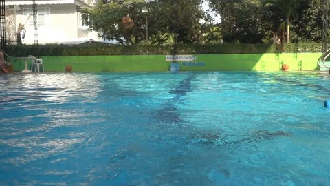 Little boy relaxing training lesson in swimming pool summer time Stockbeeldmateriaal 74618480