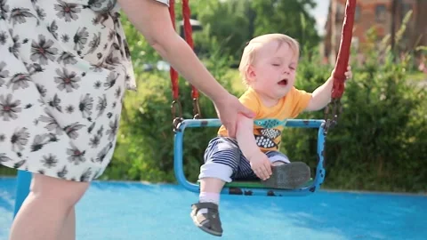 A little boy rides a swing Stock Footage 133120164